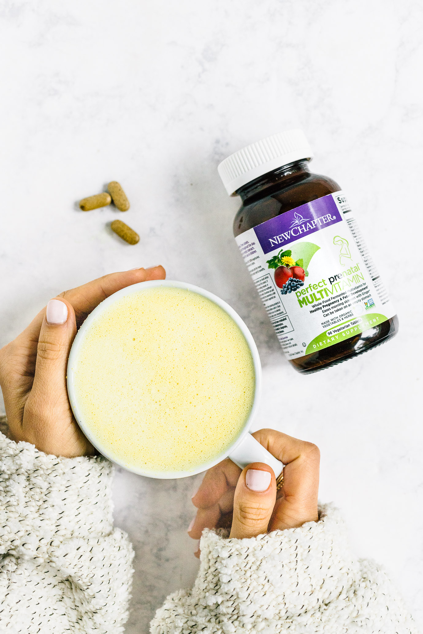 New Chapter's Perfect Prenatal Multivitamin bottle and golden milk latte