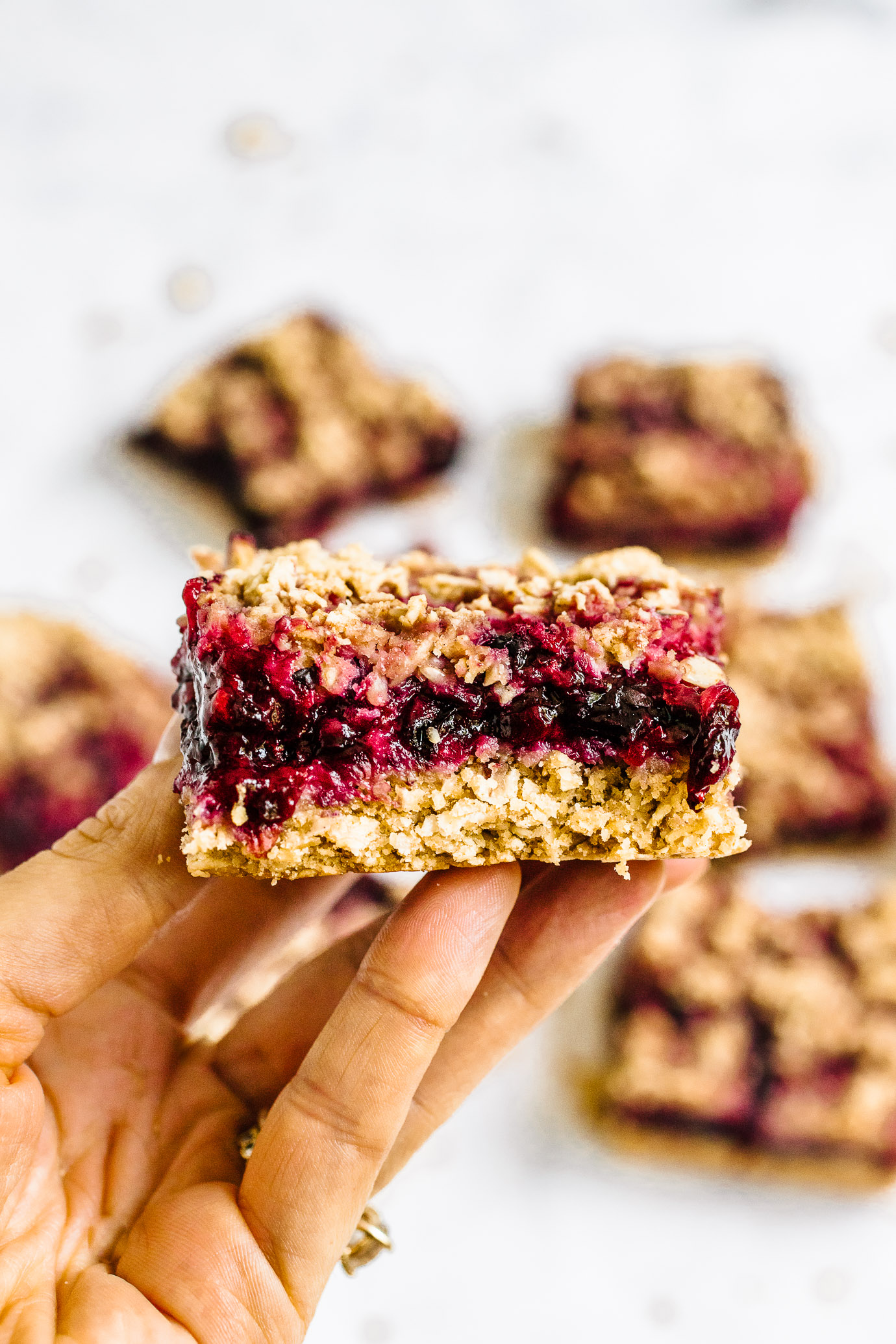 close up of mixed berry crumble bar layers