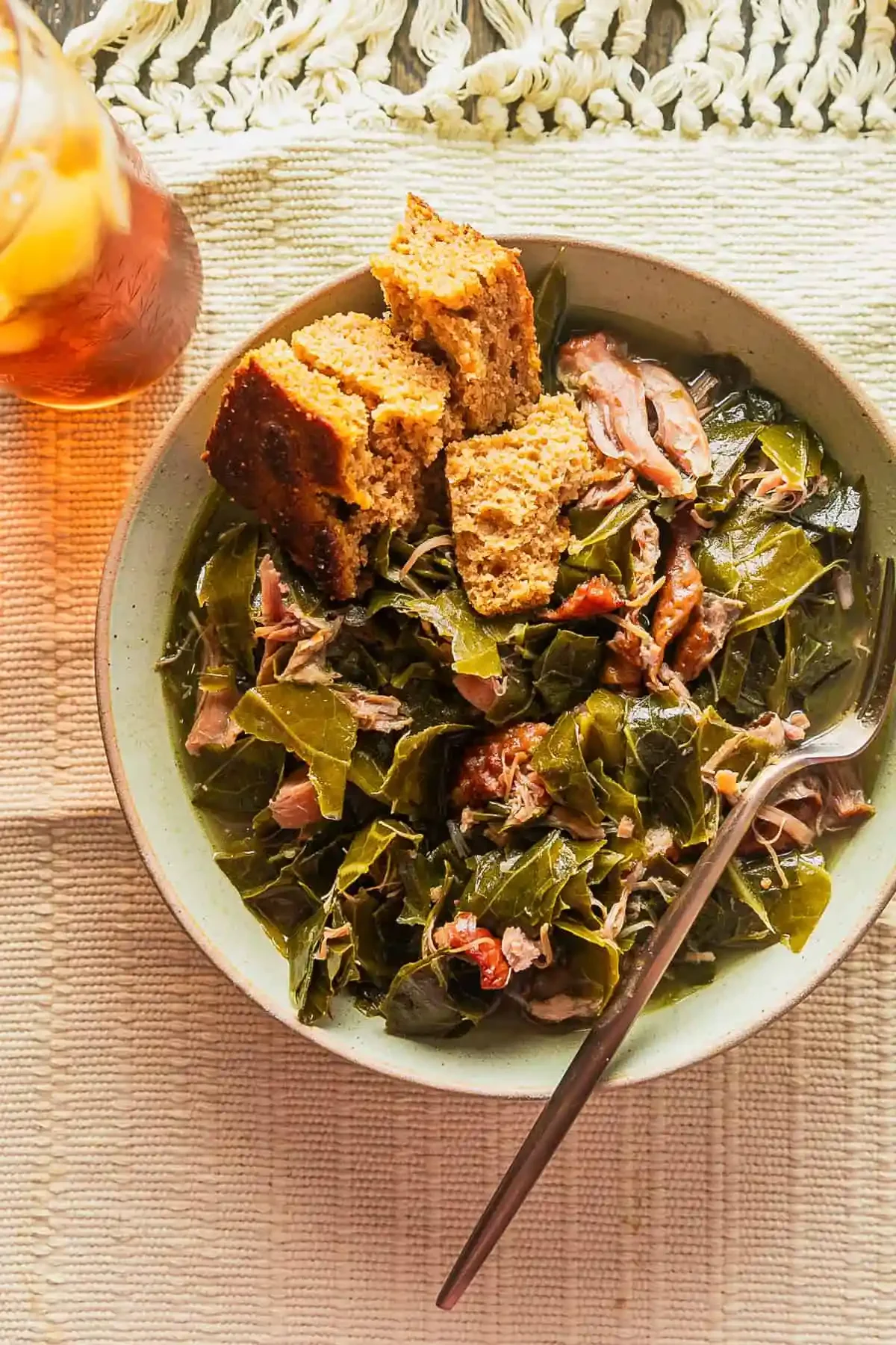 southern-collard-greens-with-smoked-turkey-overhead-to-the-side.webp