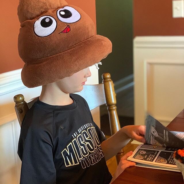 Home schooling during quarantine is just better with a poop emoji on your head.