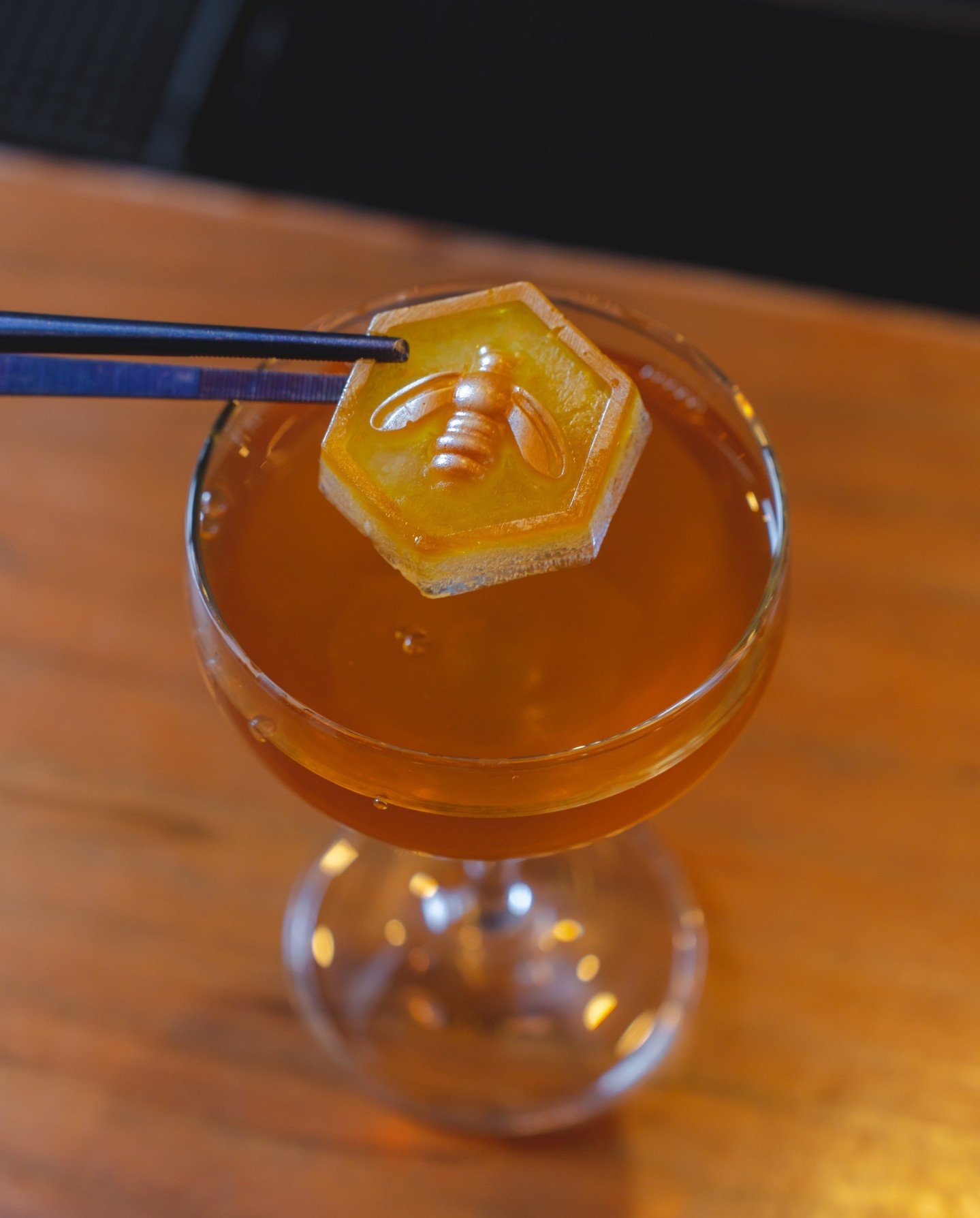 Buzzing with flavor! 🐝✨ Sip on our tantalizing Kentucky Sting cocktail, where Beeswax-infused Yellowstone Bourbon meets the sweetness of local honey, a hint of lavender,  the unique bitterness of Amaro Nonino, and crowned with a honeycomb cube. 🍯