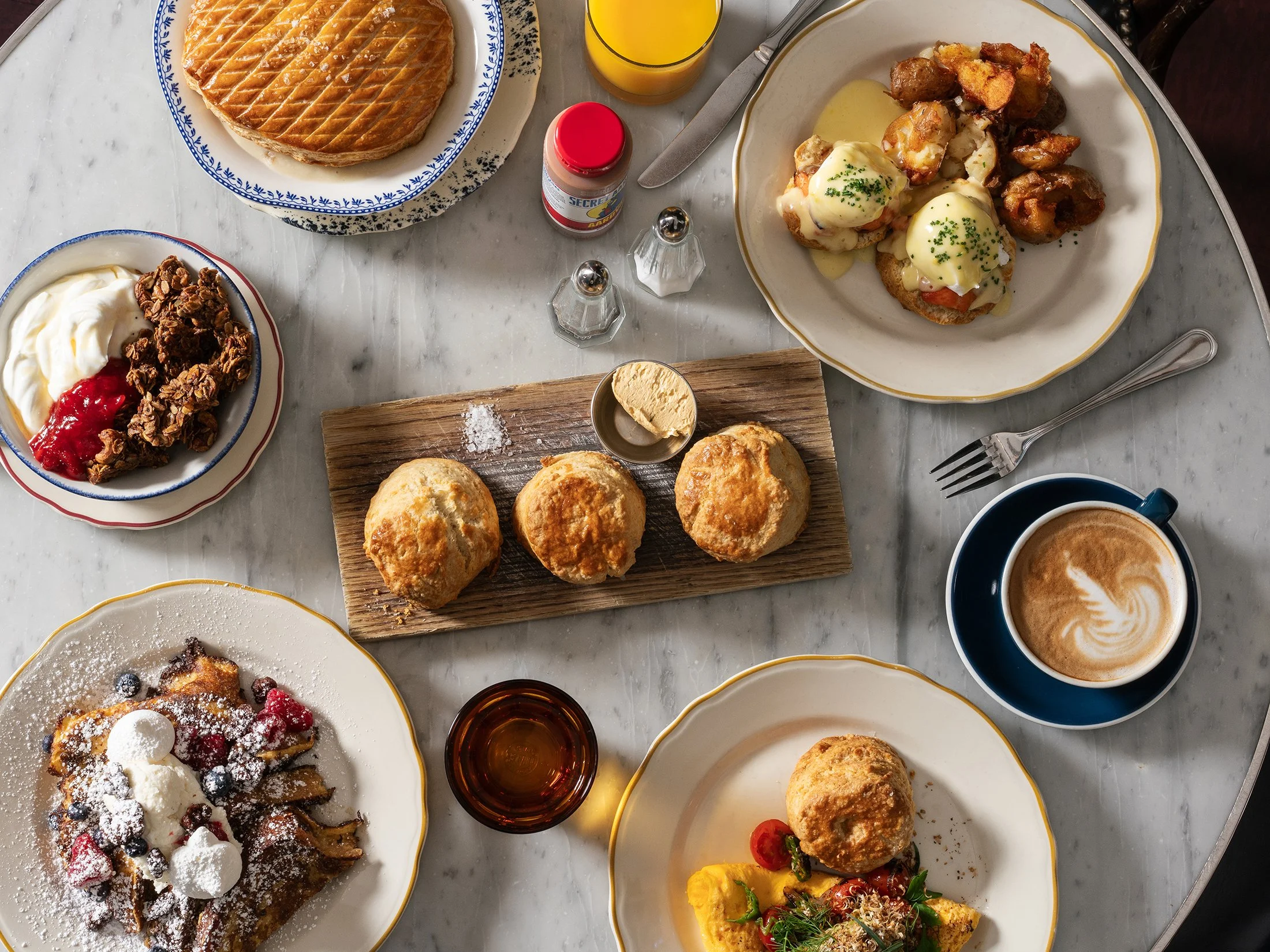 overhead view of breakfast with biscuits, coffee, and more