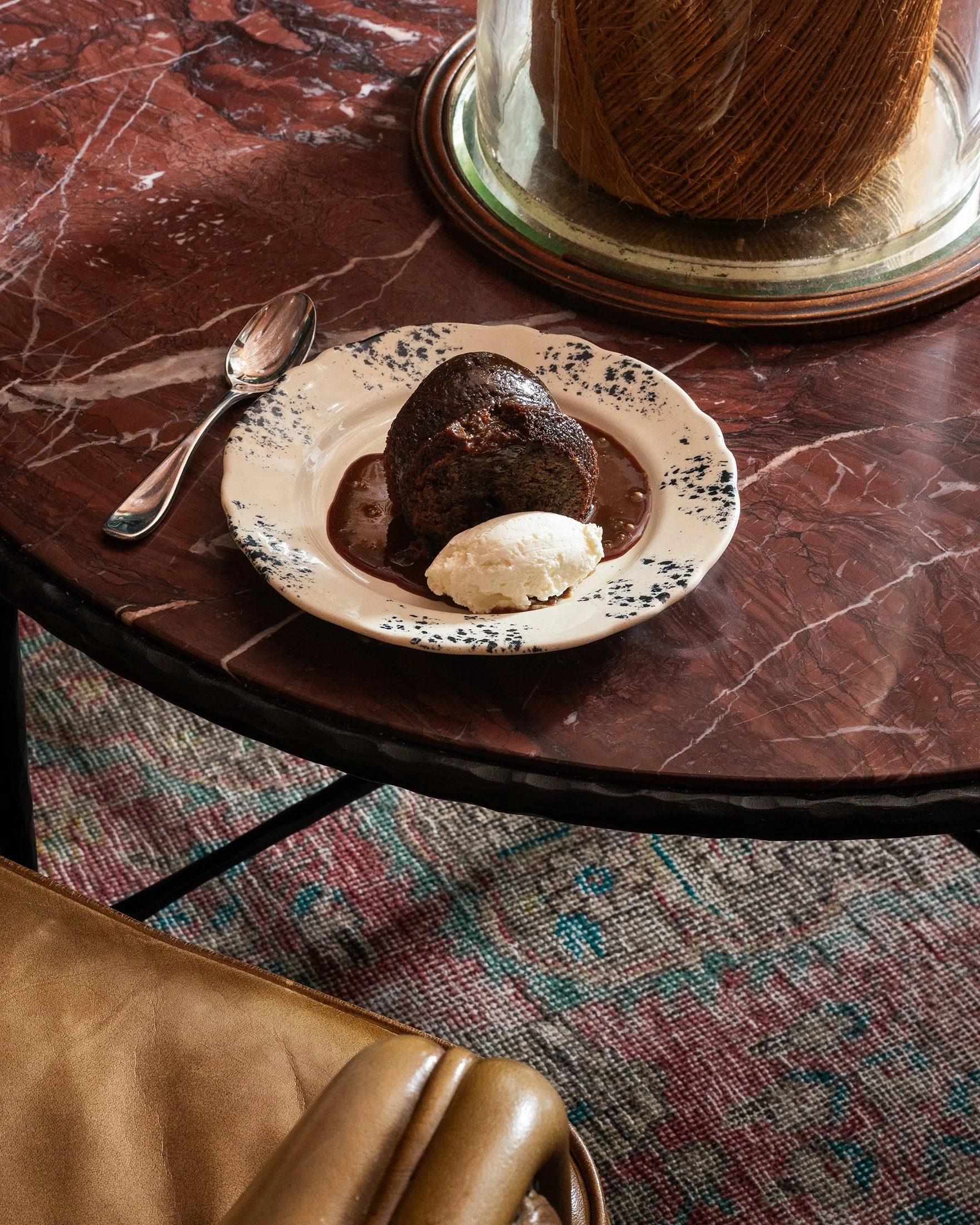 sticky toffee pudding on a marble table