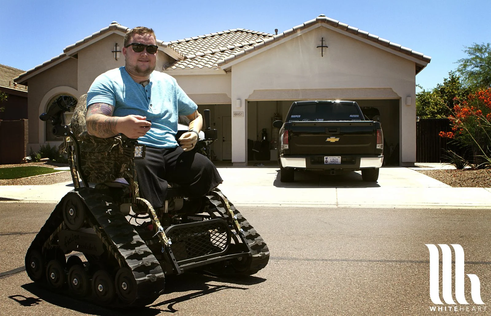 JoshActionTrackchairWLOGO.jpg