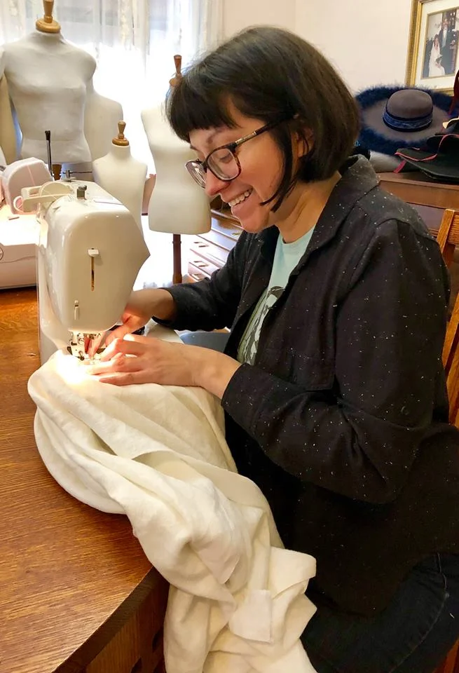 Kelli Bland sewing 17th century shirts.