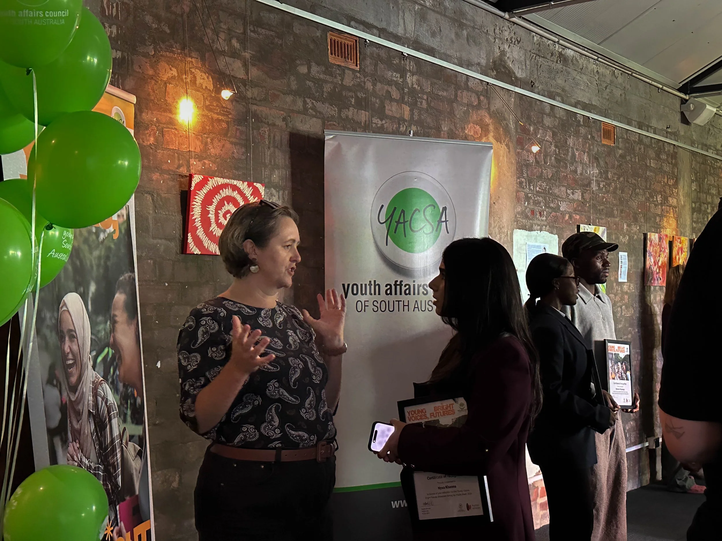 Hon Melanie Selwood MLC speaks to young person, Nysa