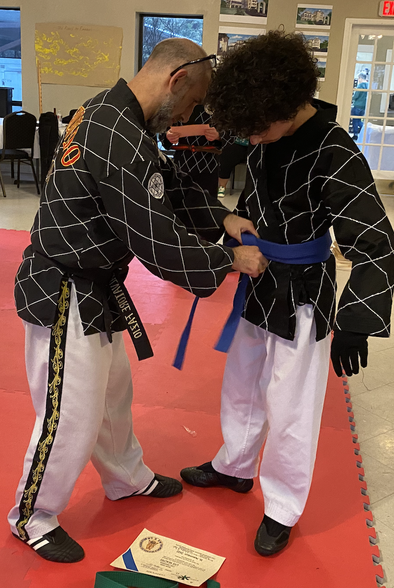 Andrew and dad blue belt.png