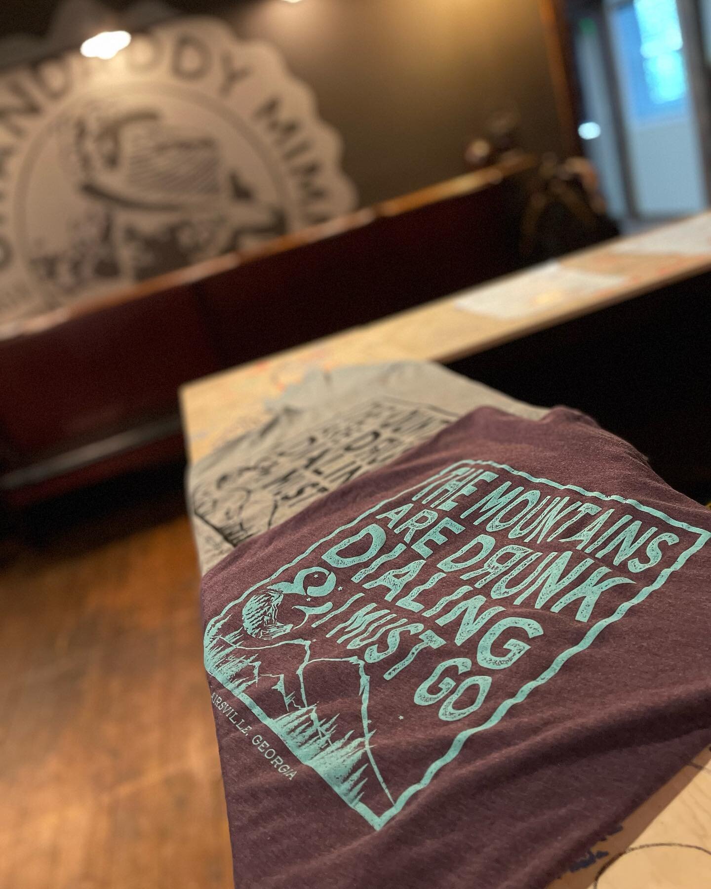 You loved our staff MM&amp;M shirts, so we thought we&rsquo;d let you get in on the fun! 

AVAILABLE NOW: The Mountains Are Drunk Dialing &amp; I Must Go tees at GDM! TWO color options (gray/black &amp; purple/teal). Hurry in because we know these wi