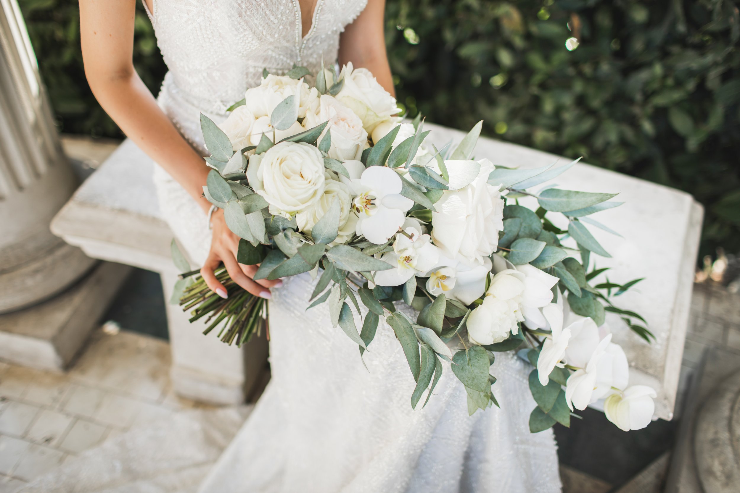 bride-holding-in-hands-elegant-blooming-bouquet.jpg