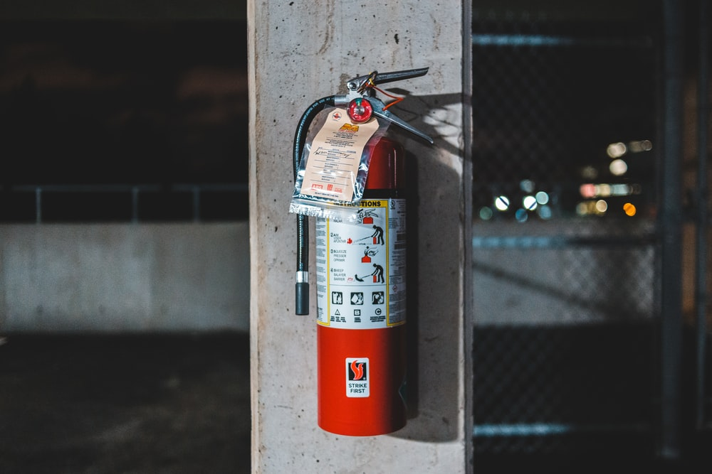 Fire extinguisher hooked on a wall