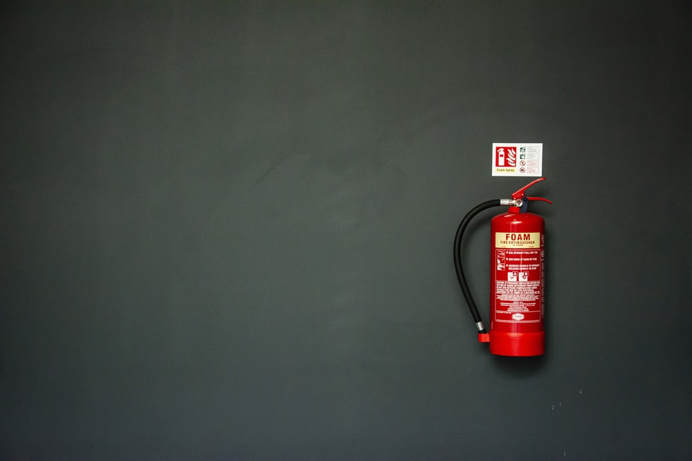 A fire extinguisher on a black background