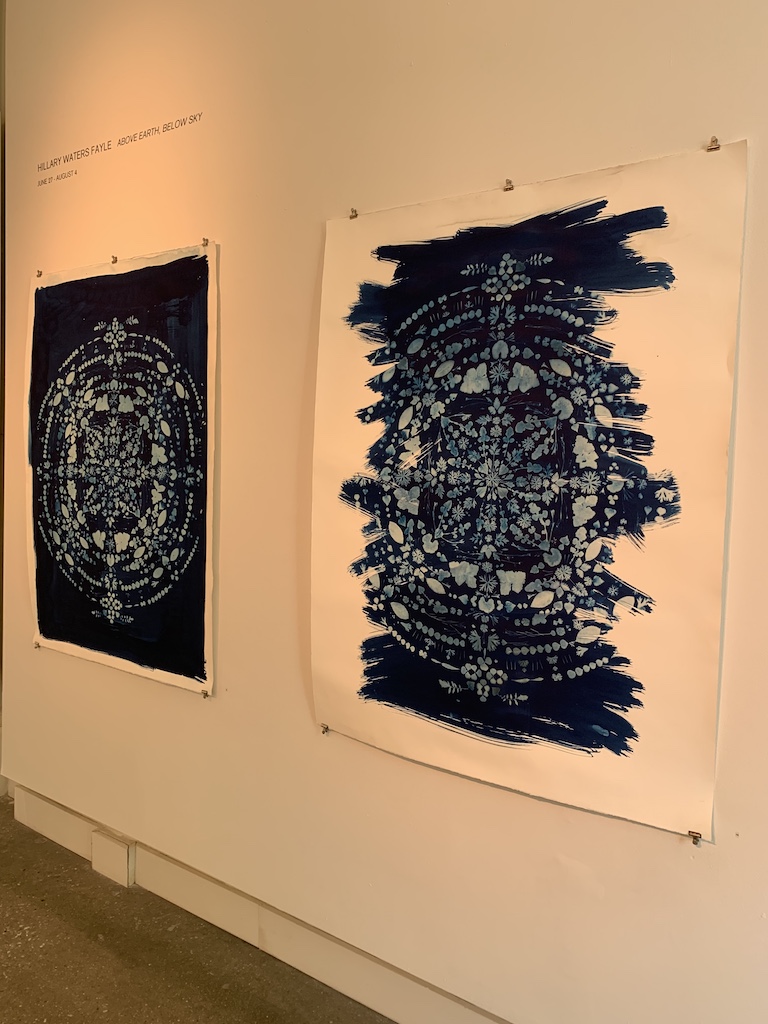 Two pieces from the Above Earth, Below Sky exhibit at the Quirk Gallery.