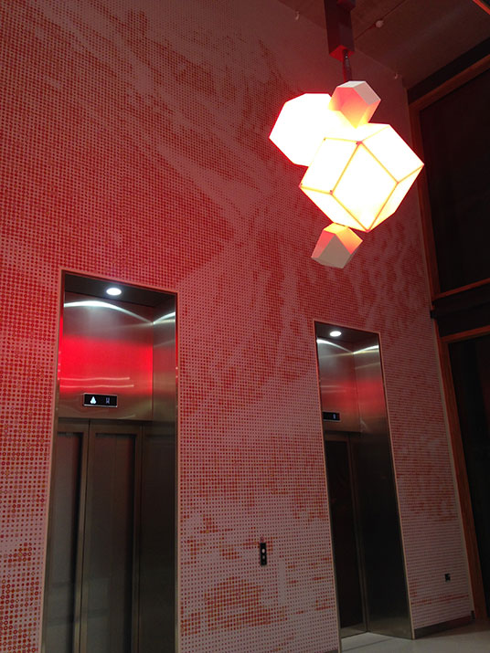 Patterned walls by Karel Martens and lights by Angella Bulloch