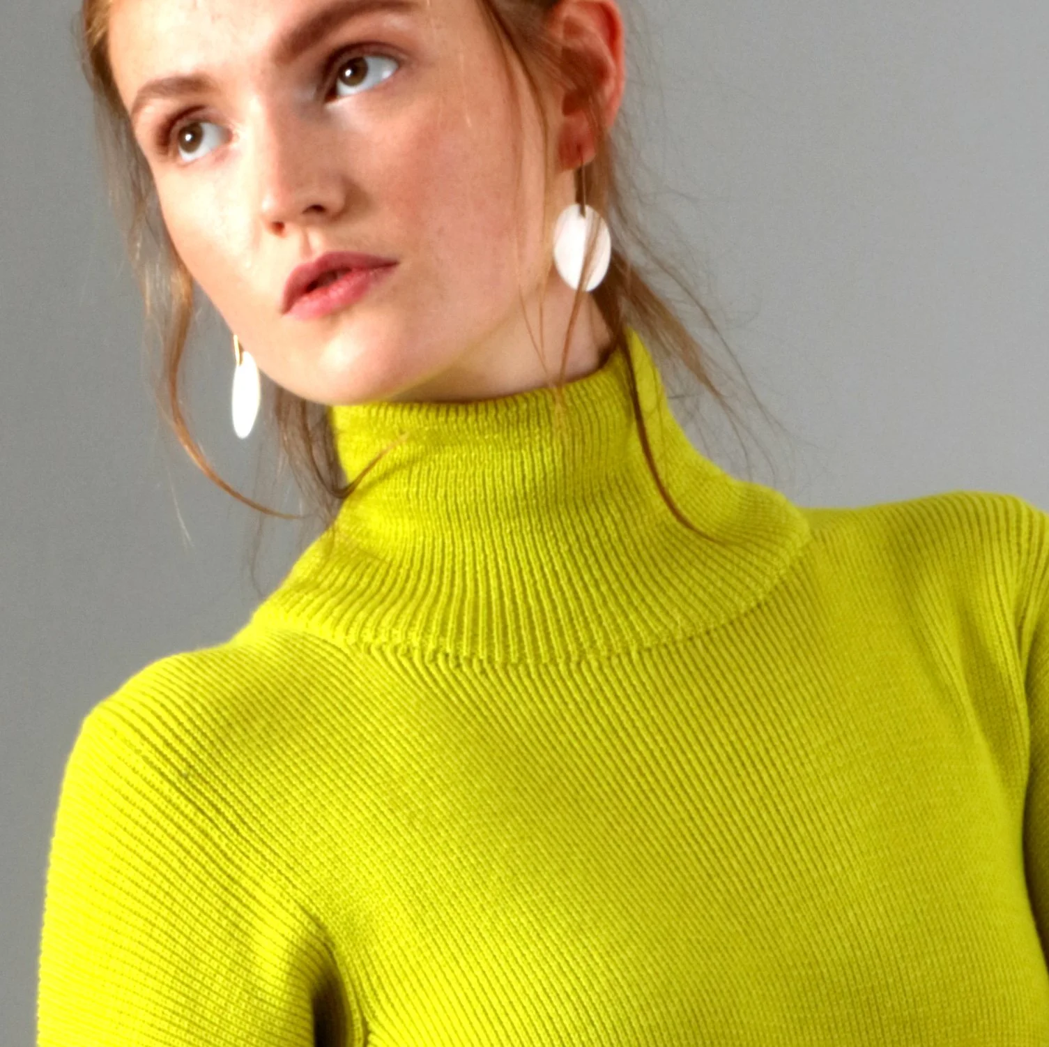 woman in green pullover dress