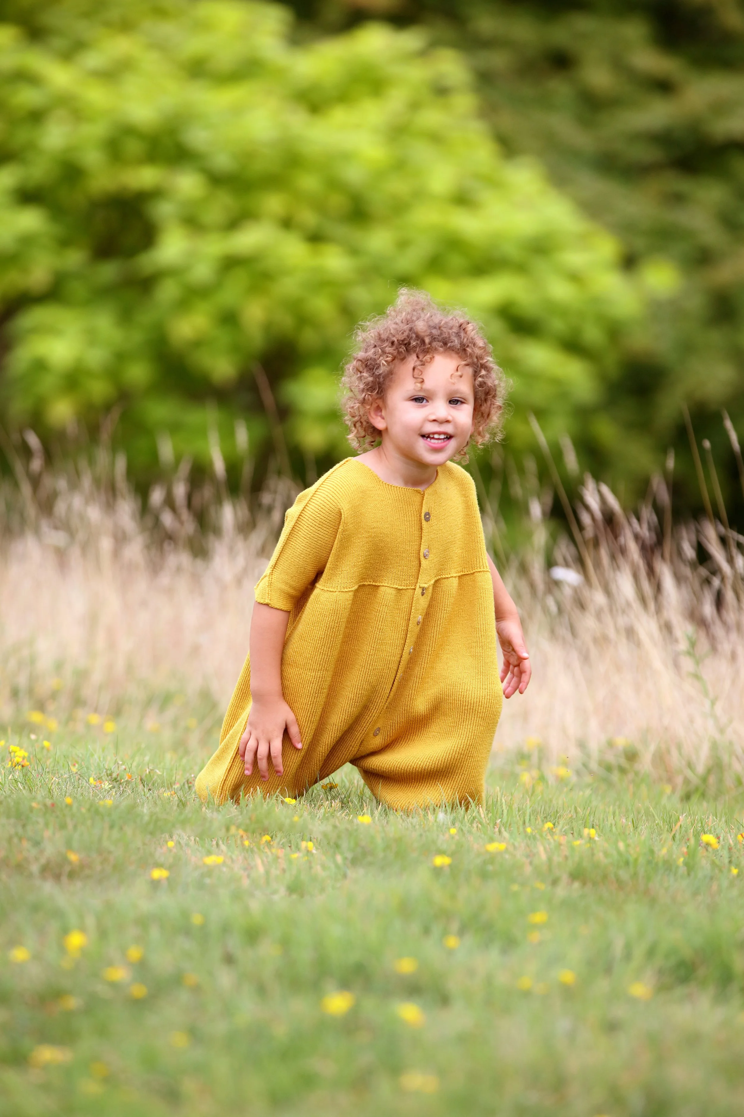 young girl in yellow jumpsuit