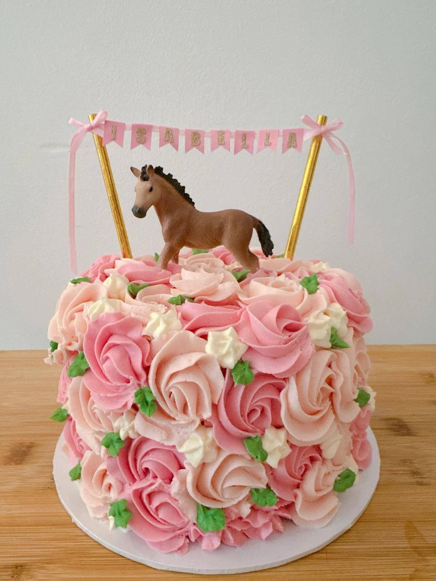 Birthday cake for Isabella - she wanted lots of pink flowers and a horse! #customcake #birthdaycake #caketopper #buttercream #twickenhamcake #madetoordercakes