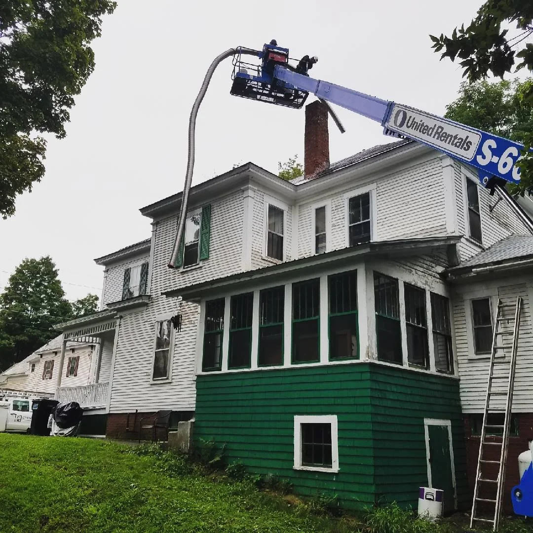 Chimney Savers donated time and materials to repair two chimneys on this Claremont, NH, home in September, 2018.