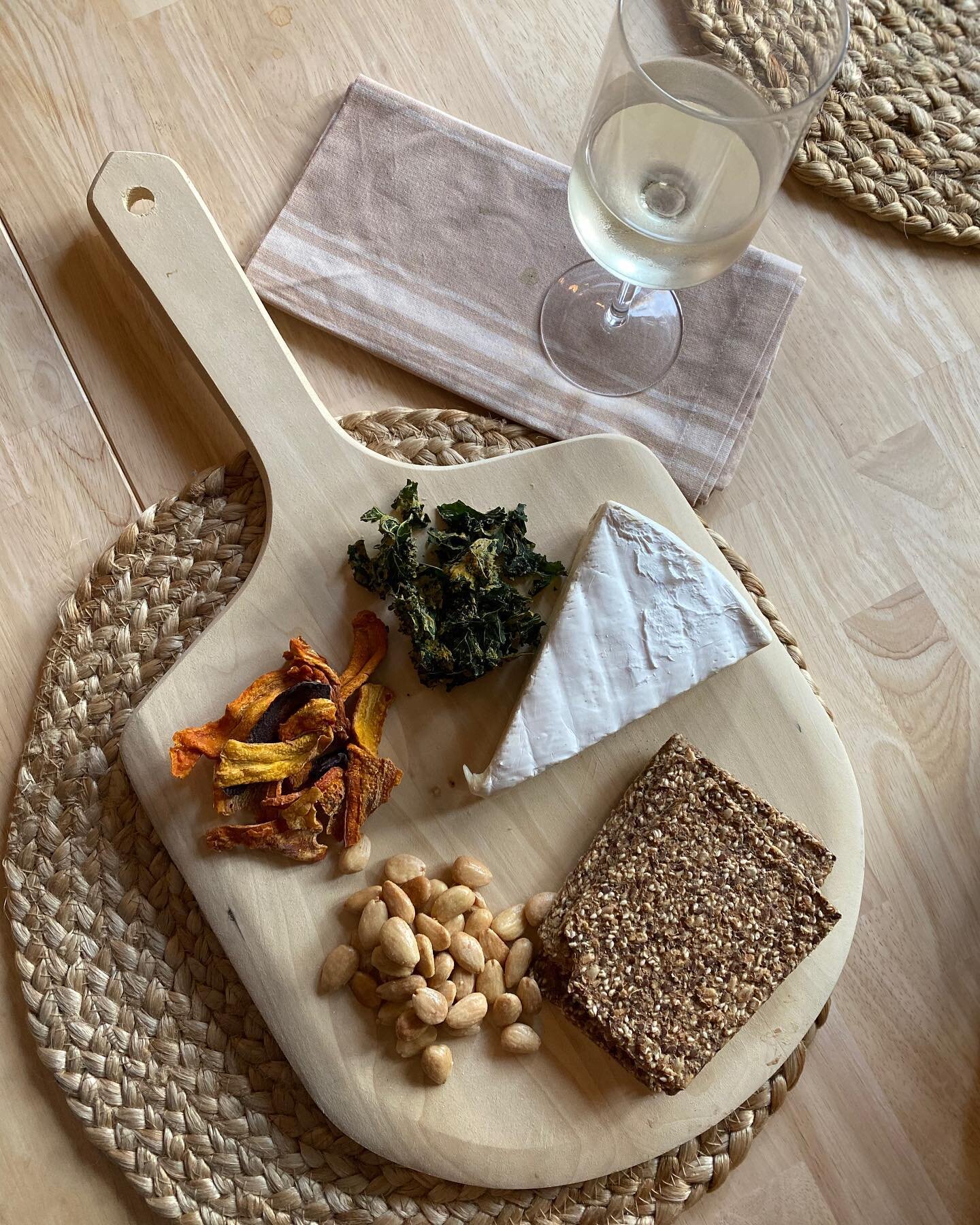 The smoke from the fires in LA is so so bad 😞 We are bunkering down inside today and the upside is definitely this impromptu cheese board&mdash;kale chips, dehydrated carrots, olive oil sea salt almonds, and a triple cream Brie with seed crackers wi