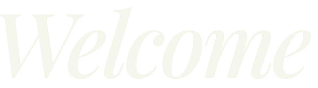 Decorative welcome sign in gray and black script text on a black background.