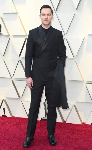 A new approach to the black on black suit, Nicholas Hoult looked dapper in Dior.