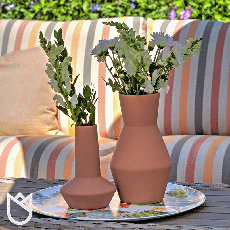 We-suggest-adding-personal-touches-to-your-outdoor-spaces-such-as-lanterns-candles-and-greenery.-Various-colored-and-patterned-pillows-make-the-spaces-feel-just-as-elegant.png