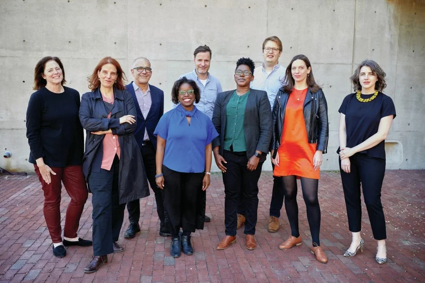 Courtesy Harvard GSD. Class of 2020 of Harvard GSD's Loeb Fellowship program. Left to right: Elizabeth Kay Miller, Eleni Myrivili, Pedro Gadanho, Michelle Joan Wilkinson, Wolfgang Rieder, De Nichols, Andrew Salzberg, Paloma Strelitz, and Deborah Helaine Morris.