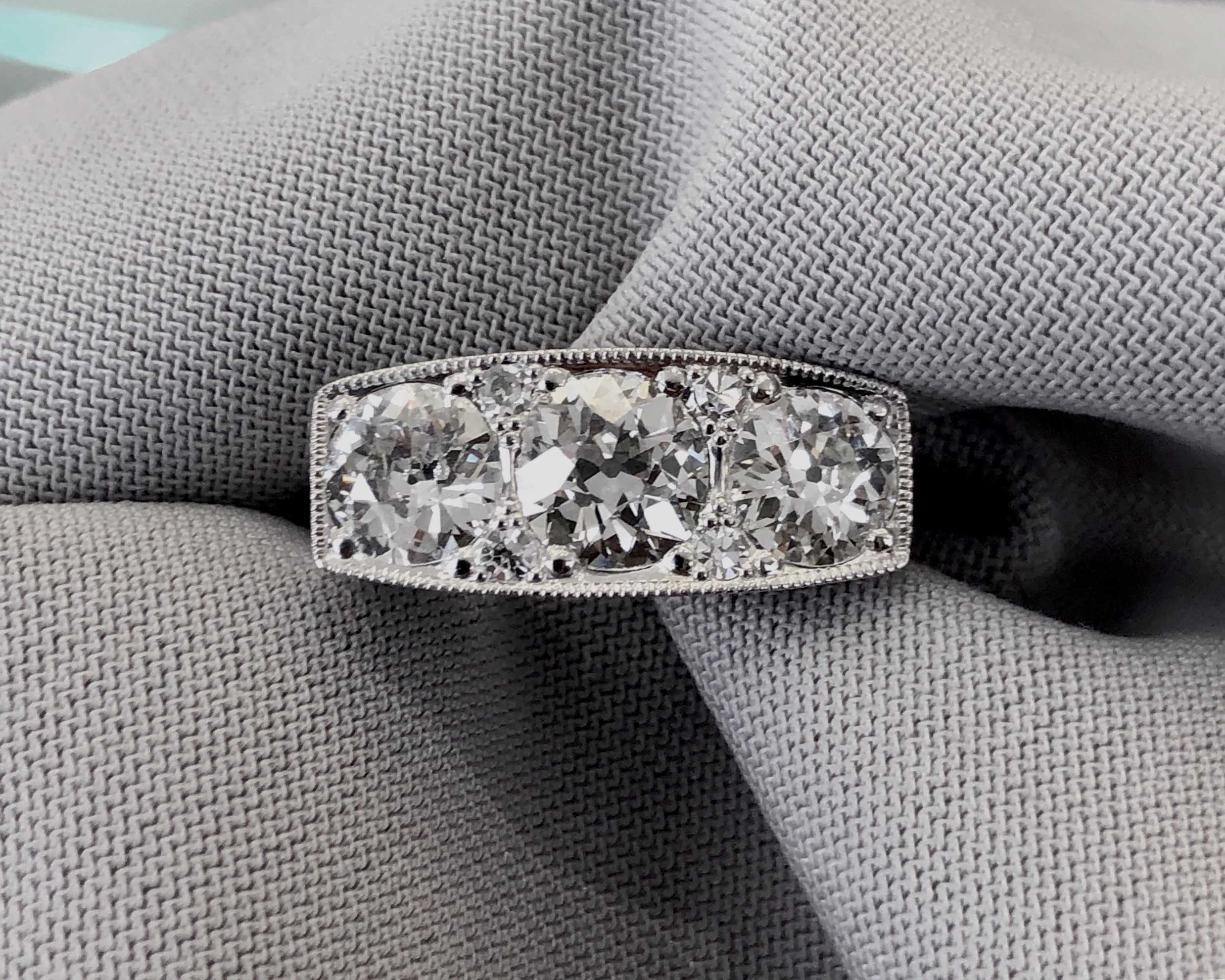 After: Complete platinum top plate replacement and secure setting of each stone.