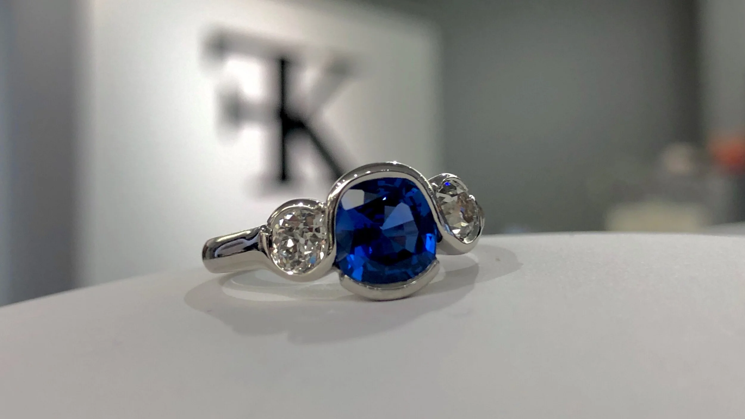 Our Wave ring featuring a family heirloom blue sapphire.