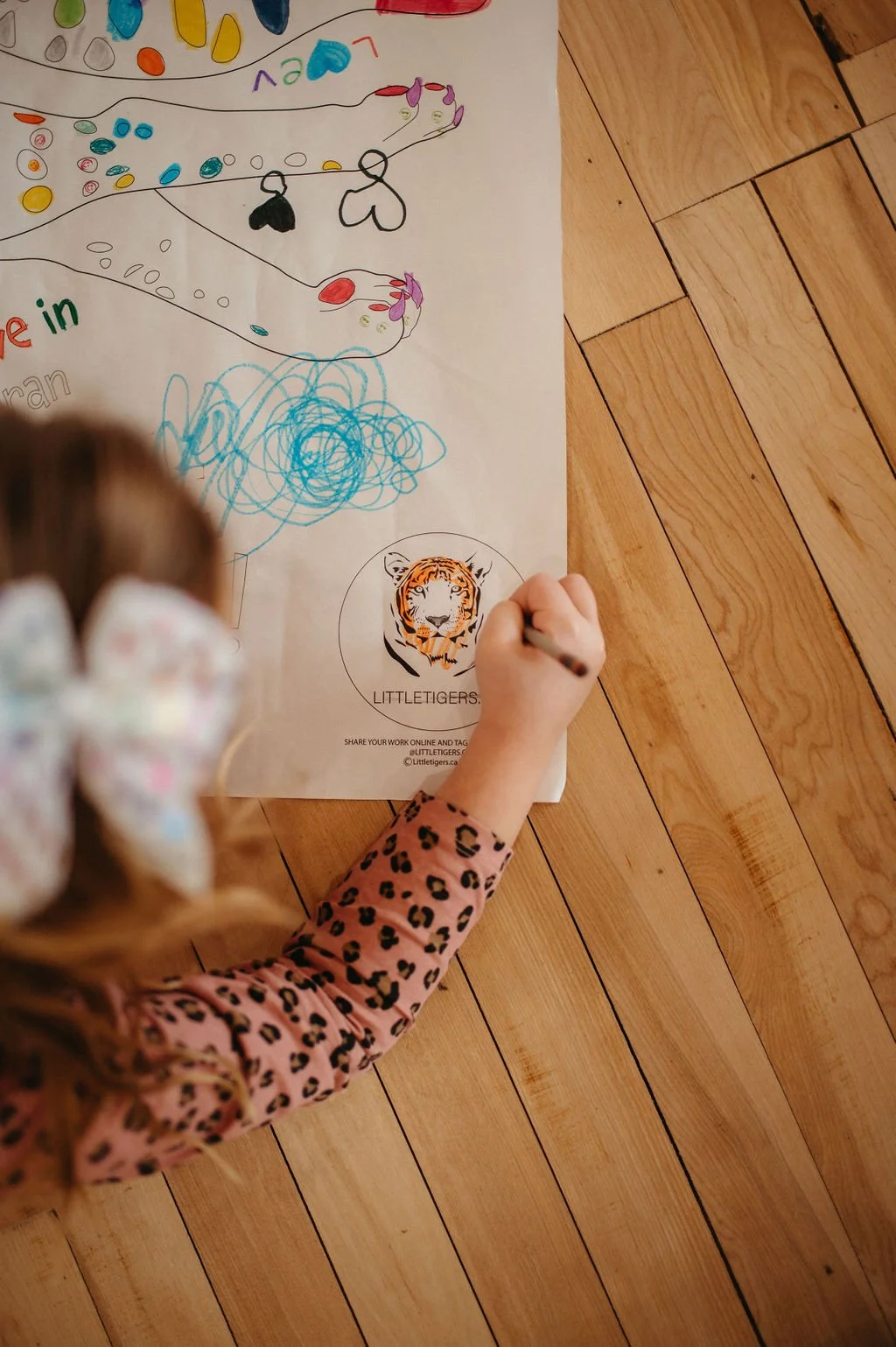 LittleTigerslogobeingcoloured.jpg