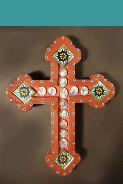 C14. Painted wooden cross with saint images.