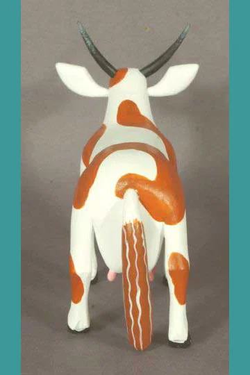 Brown and white cow, view 3