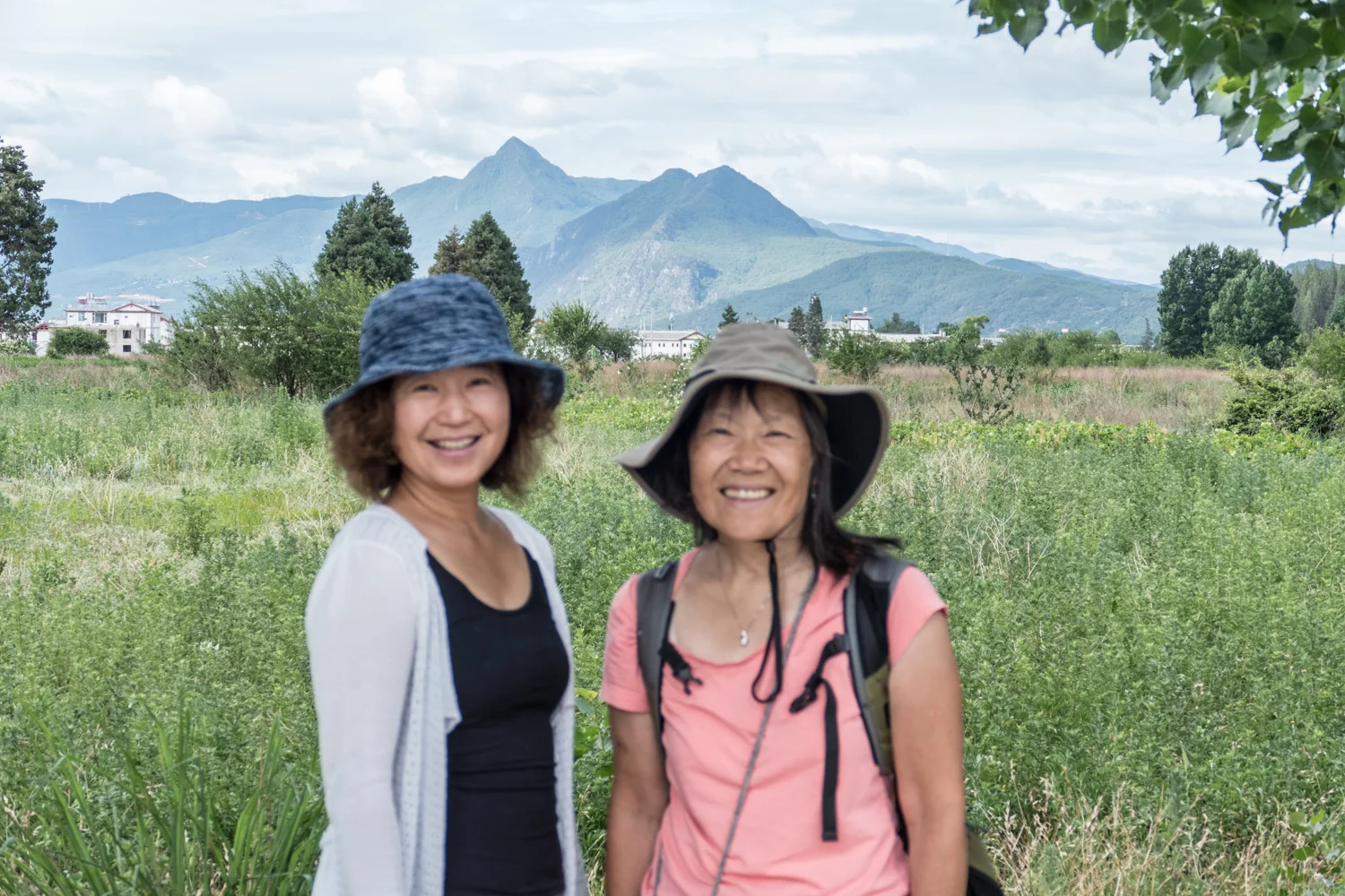 Lil with our Airbnb host on a hike to a minority village