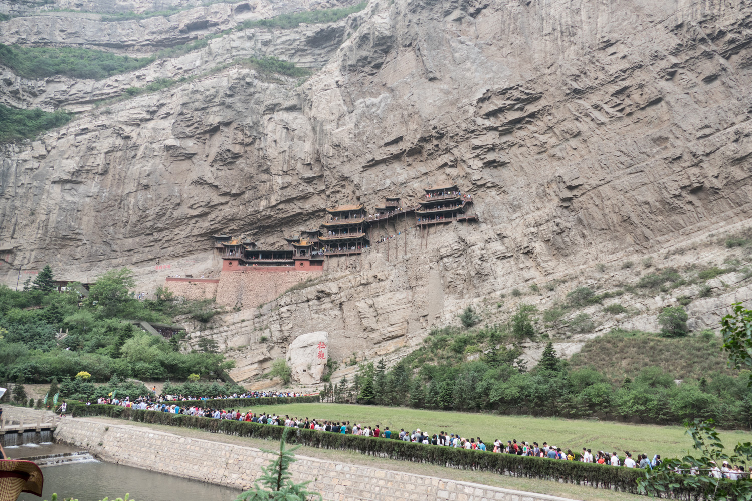 The hanging temple was built on the sheer face of a cliff. This also shows part of the long line to get in.