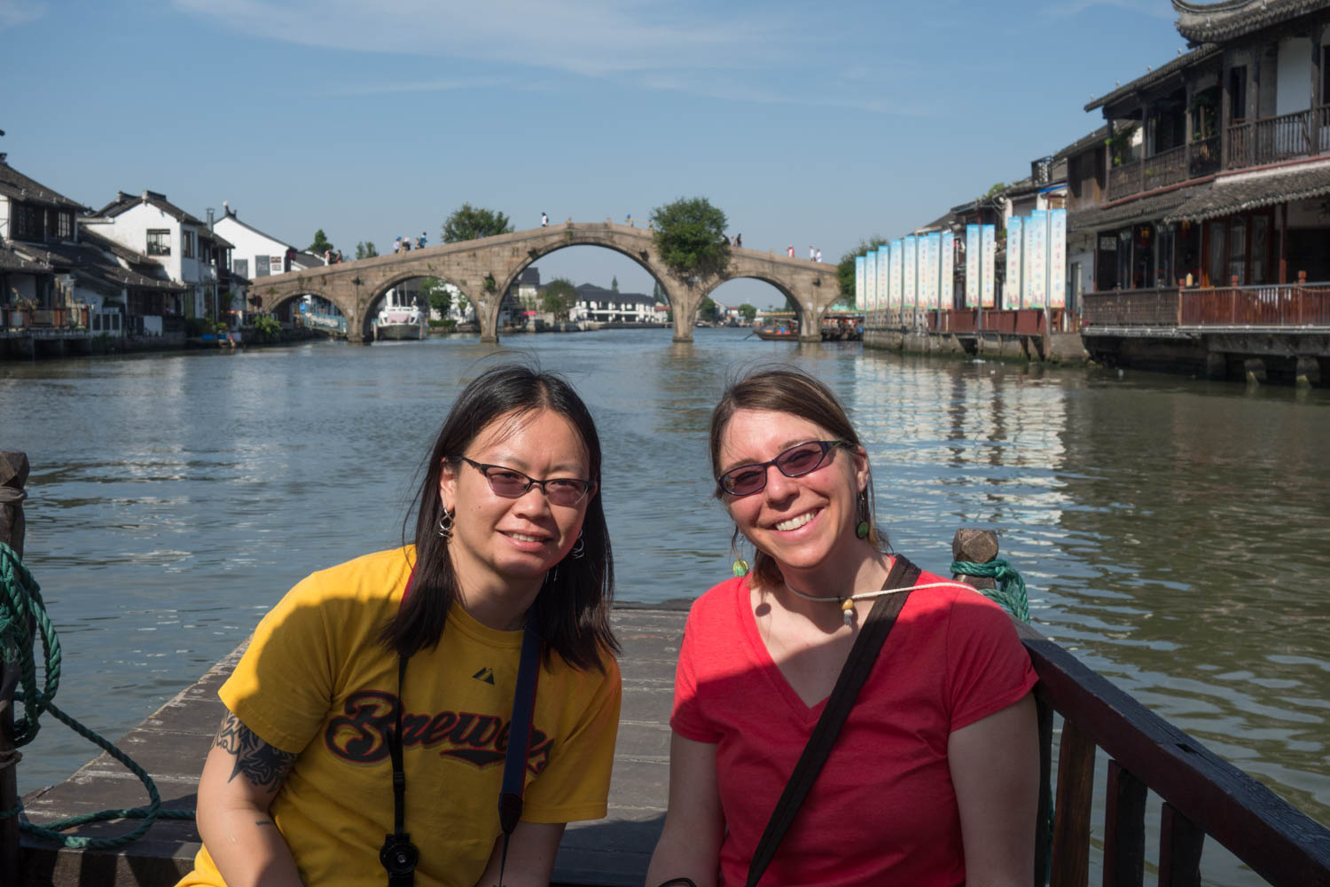 Laura and Sarah on the boat with Fangsheng bridge in the background
