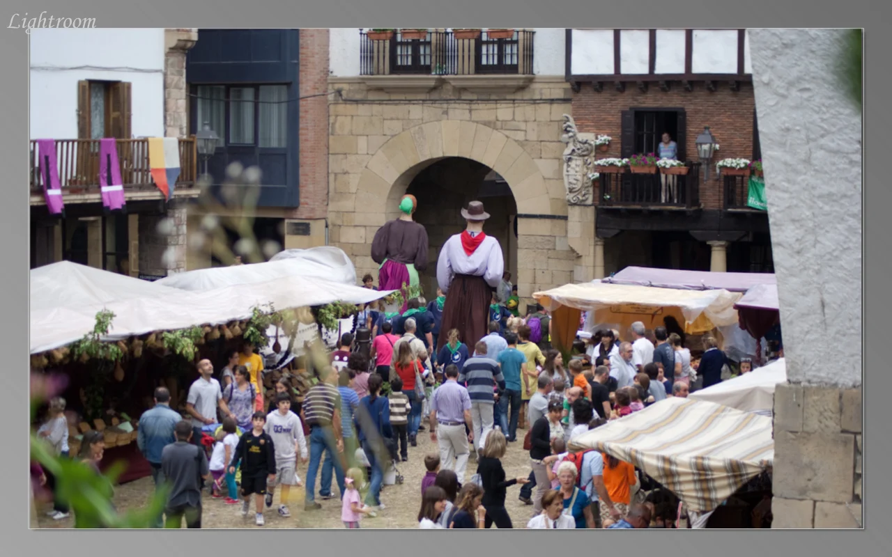 Parade through the town with two giant puppets leading the way