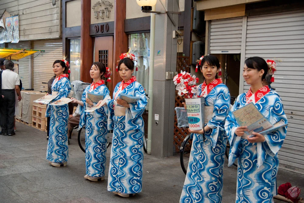 Hostesses welcoming visitors to the festivities