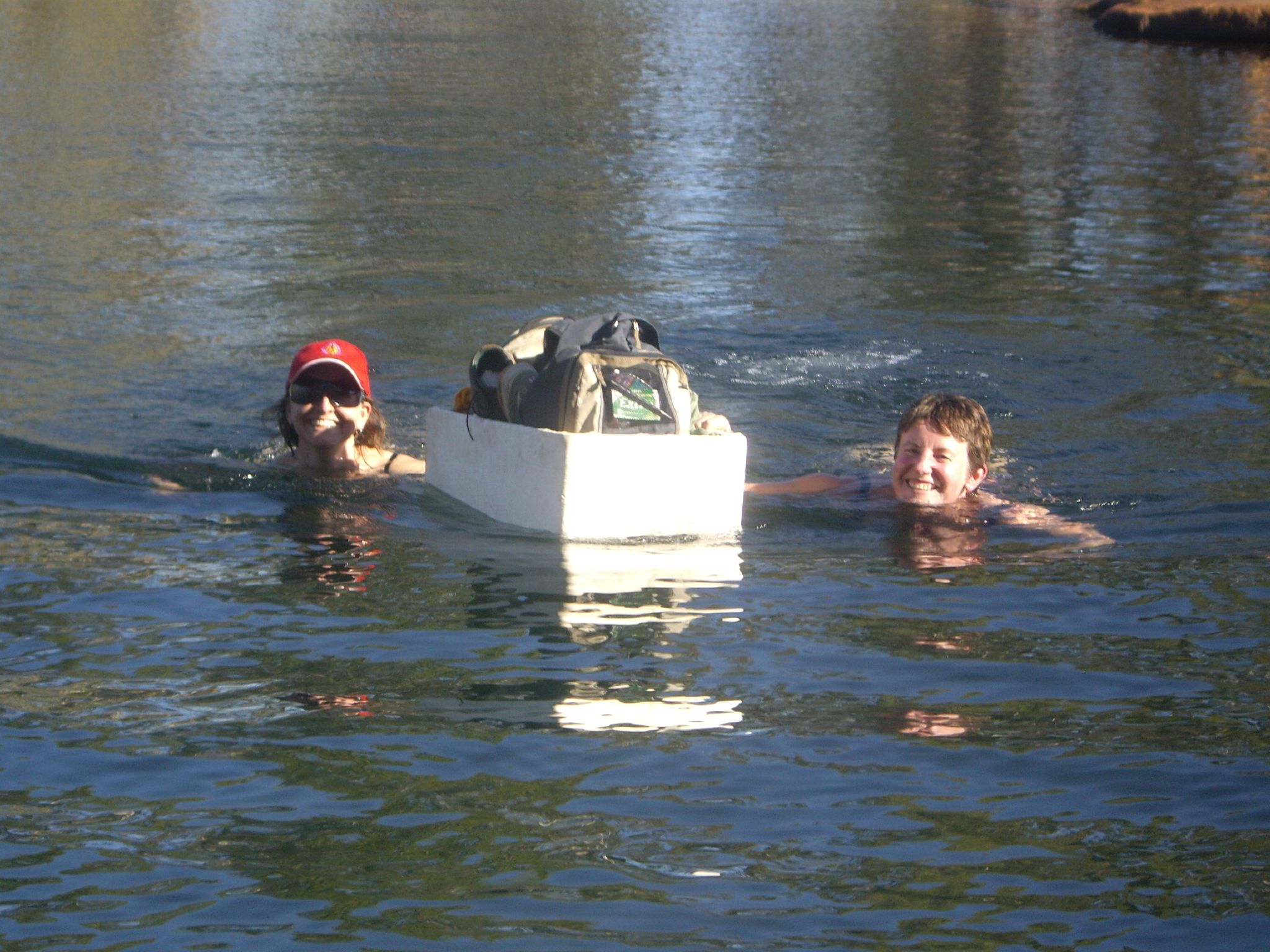 Swimming to Manning Gorge with essentials in a styrofoam boat