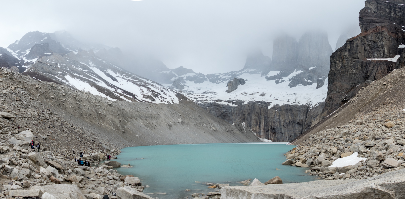 Panorama view of the base of the Torres, shrouded in the clouds. At this time it was blowing hard and sleeting. The positive thing was that we made use of all the layers we had carried up the mountain.