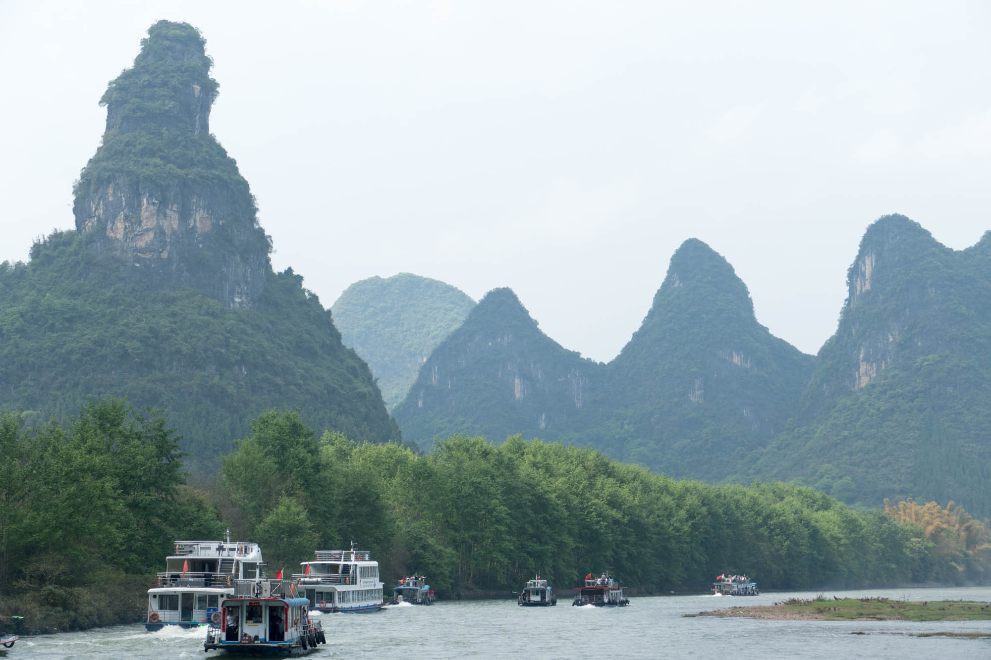 The flotilla of tour boats on the Li River. At the most scenic parts of the trip, there’s a mob of tour boats jockeying to get the front position. Not the most relaxed trip down the river.