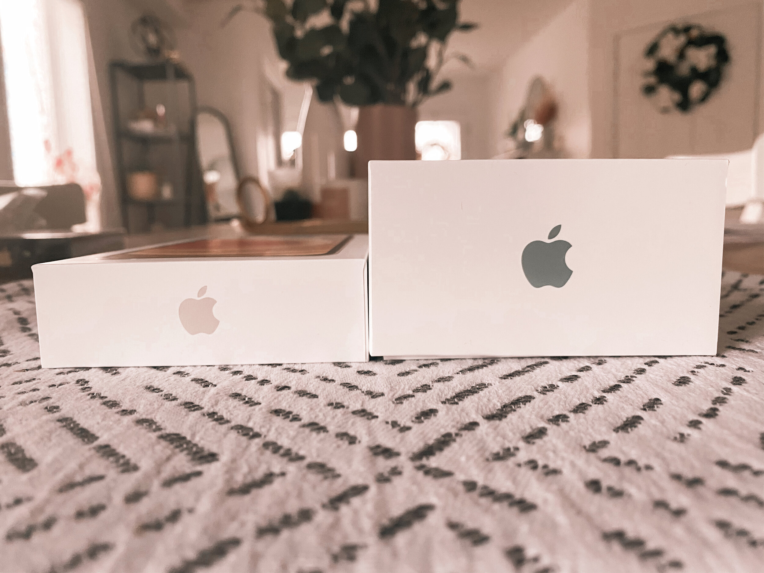 Left, iPhone 12 box. Right, iPhone 11 box