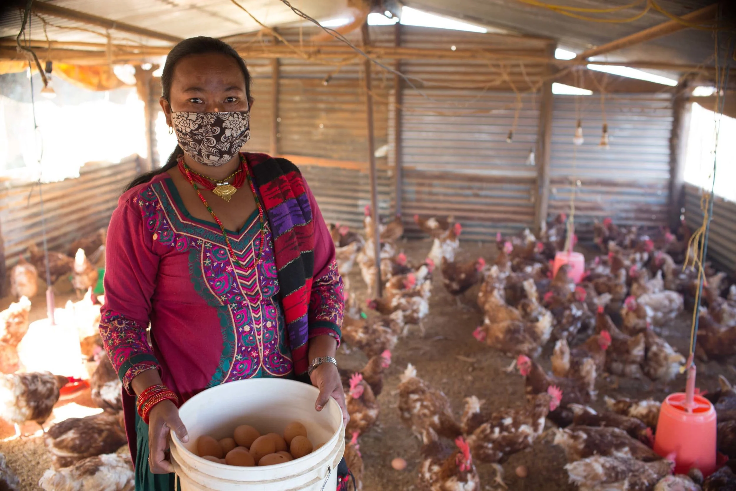 This woman was able to start a successful poultry farming business thanks to training and a small loan from her self-help group.