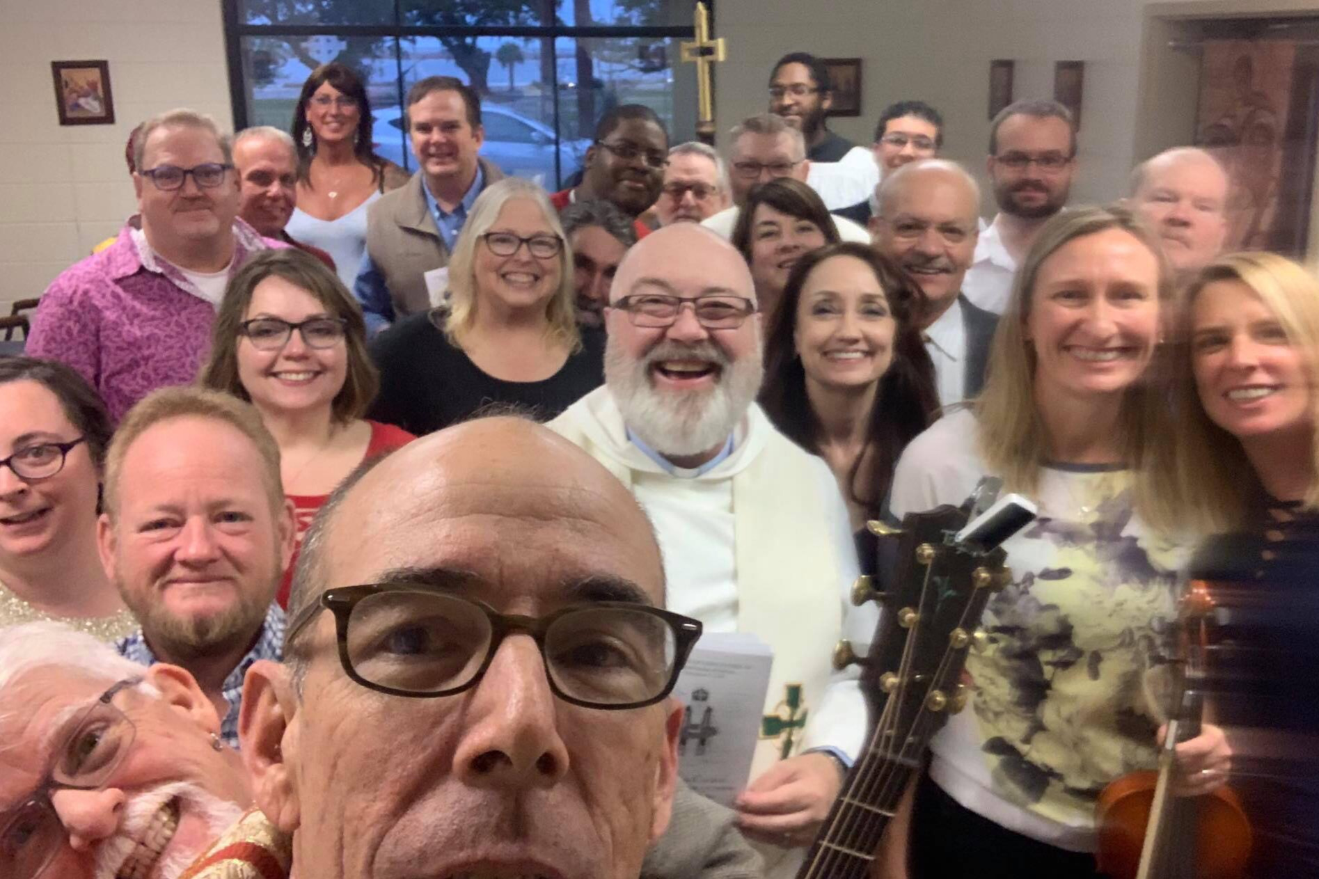 The Rt Rev Brian R. Seage, Bishop of Mississippi, takes a group selfie during his episcopal visitation to Lighthouse-St. Nicholas, 9 December 2018.