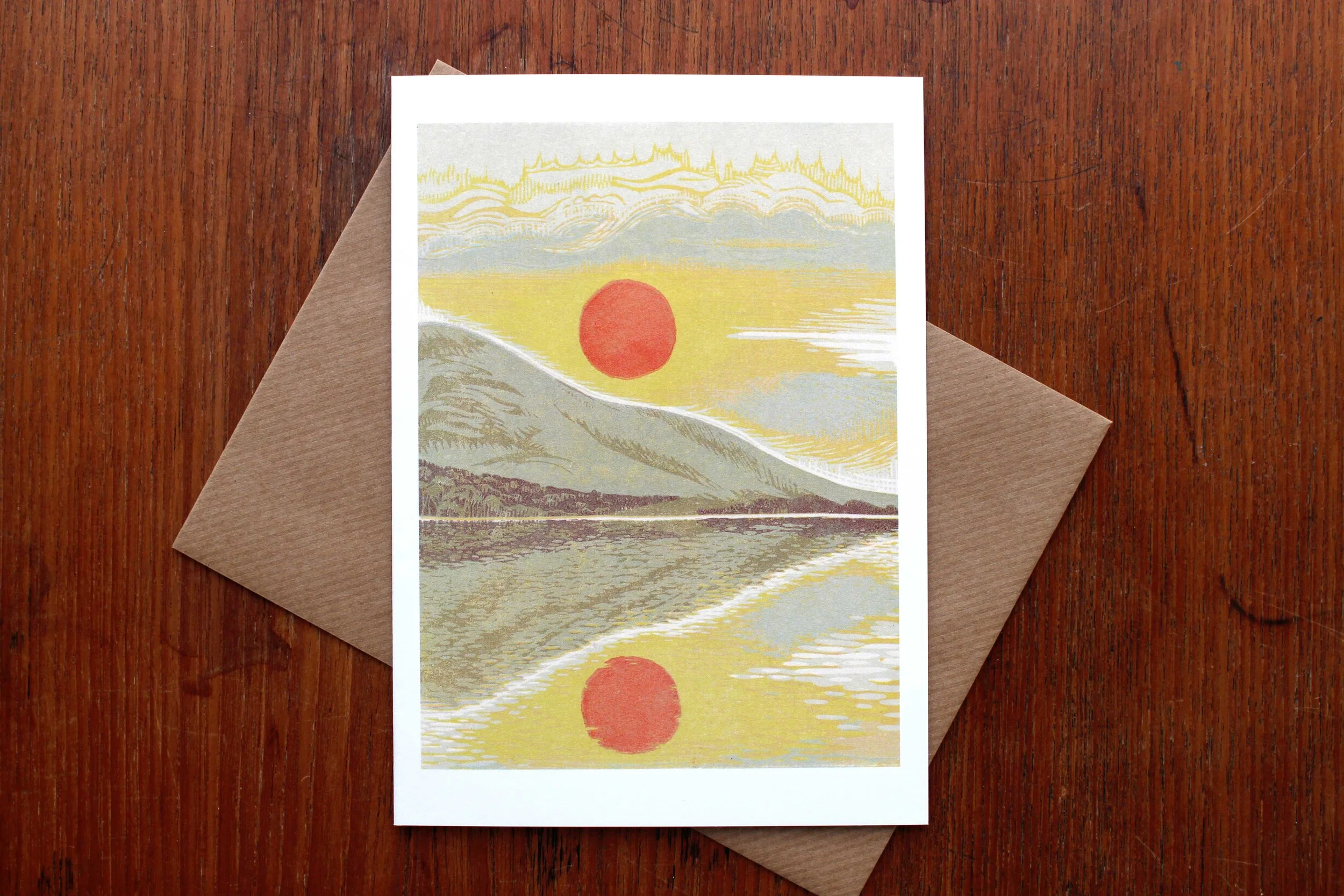 Evening's Reward linocut greeting card Cat Moore reduction print spring cumbrian fells landscape hillside sunset red pink moon blue yellow crummockwater lake district
