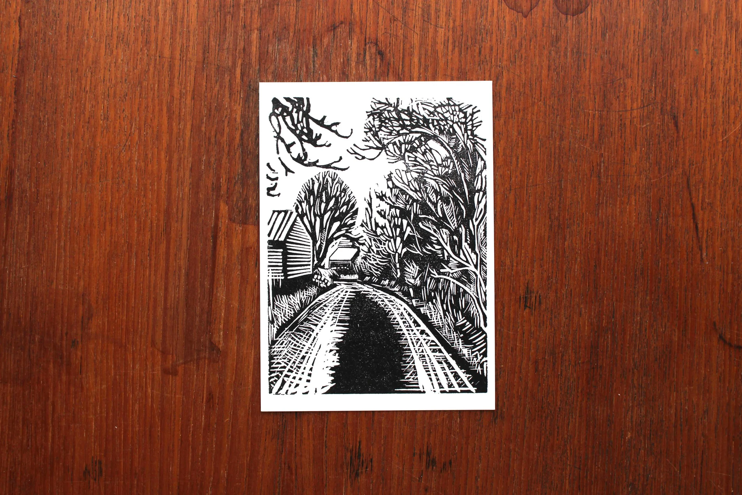 Postcard walk river down lane linocut Cat Moore print single block trees nature