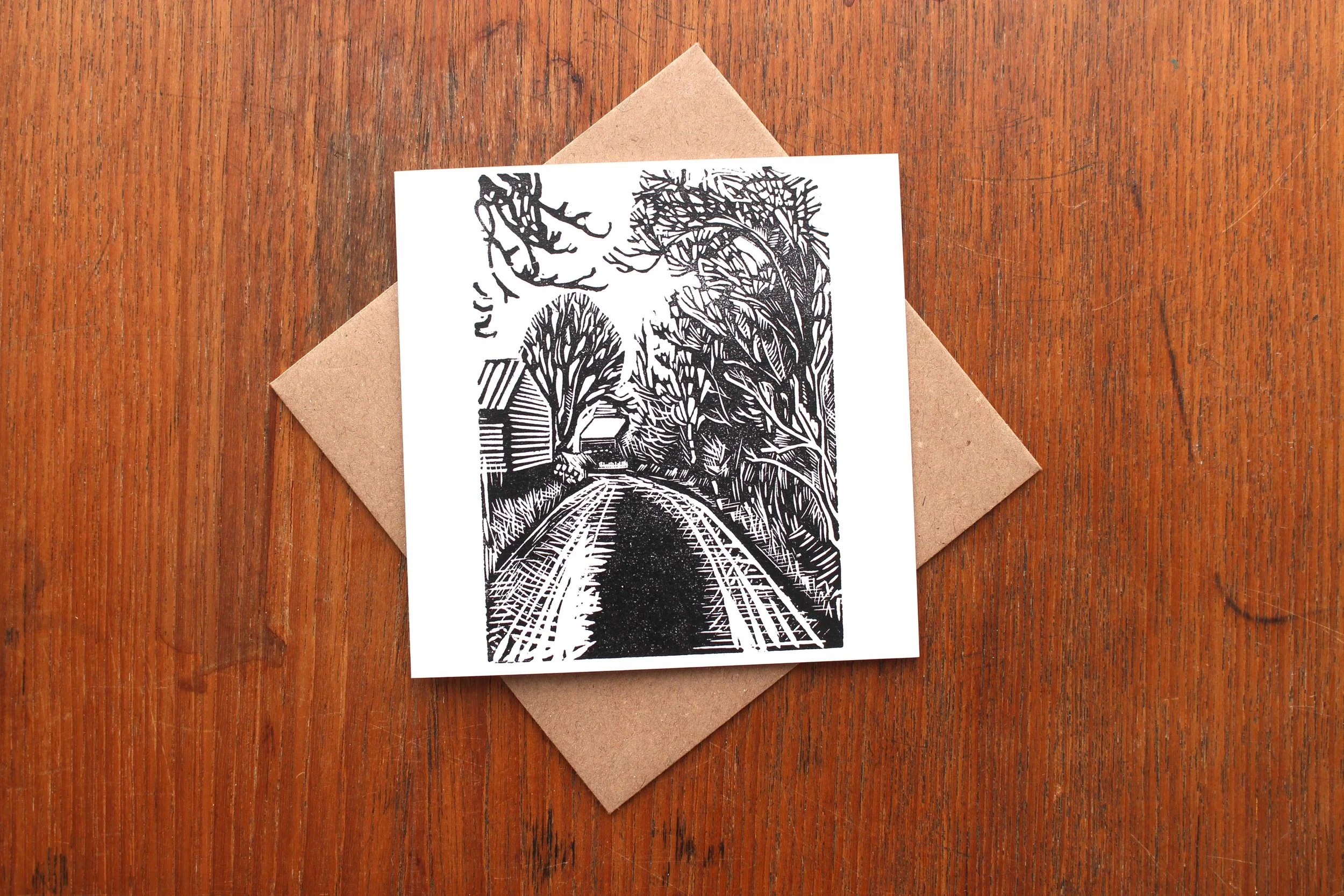 Greeting card walk river nature winter trees woodland linocut print Cat Moore Northumberland down the lane