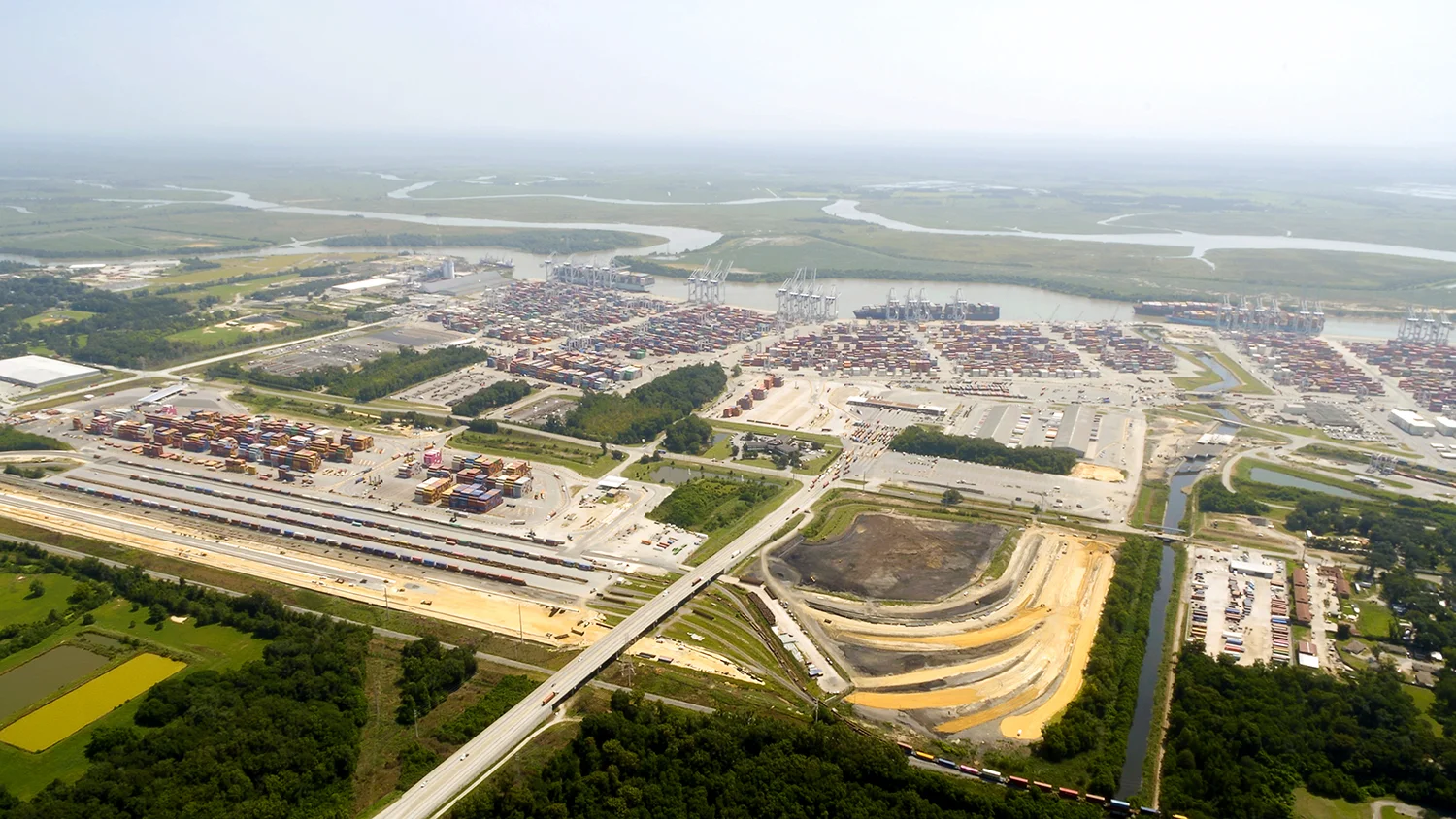 Construction on the Port of Savannah’s Mason Mega Rail project is 40 percent complete. The expanded terminal will double rail lift capacity at Garden City Terminal to 1 million containers per year. Find print quality images here . (Georgia Ports Authority)
