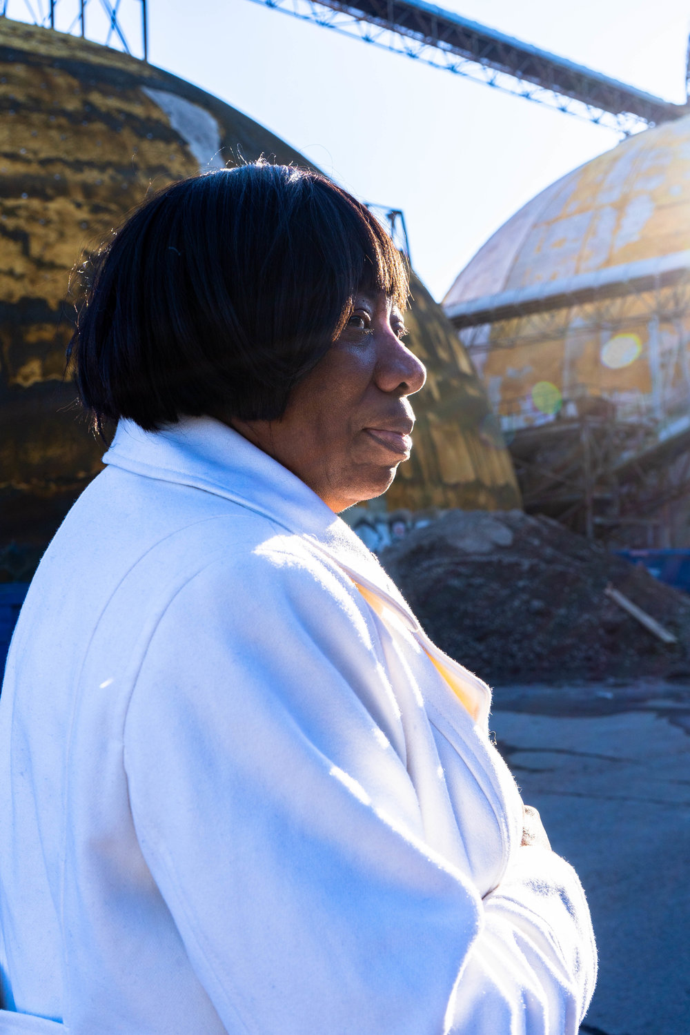 Catherine Fleming stands by the domes at the Upper Harbor Terminal site.