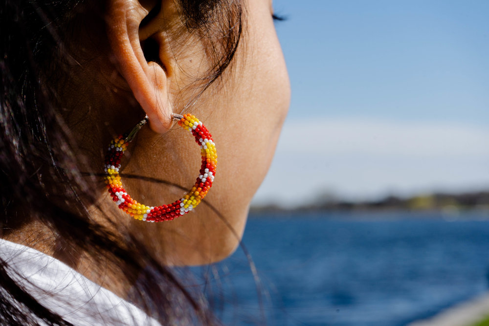 Atquetzali Quiroz stares out to Lake Phalen for a portrait. 