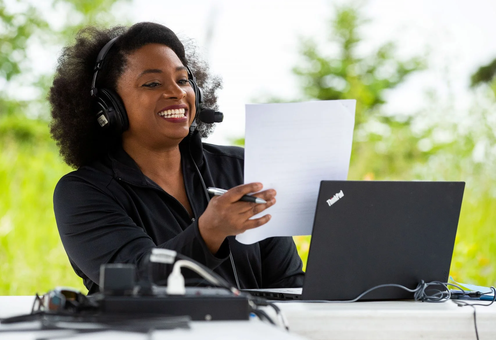 MPR News host Angela Davis broadcasts live from Tettegouche State Park on the shore of Lake Superior. Derek Montgomery for MPR News.