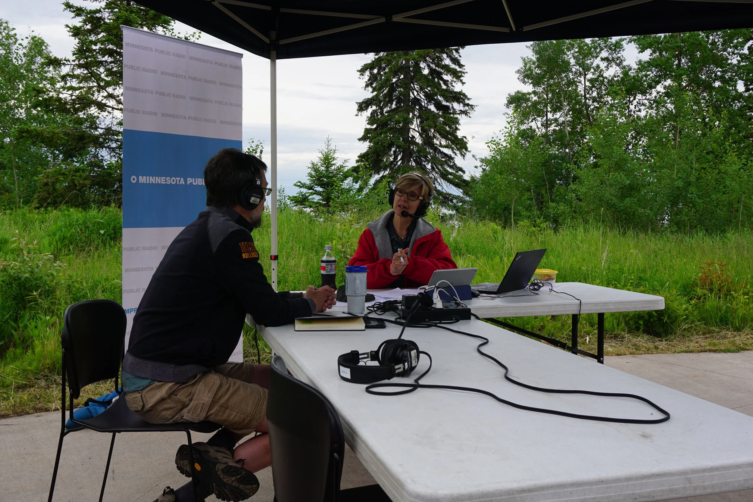 Morning Edition host Kathy Wurzer conducts an interview at Tettegouche State Park on the shore of Lake Superior. Lauren Humpert | The Water Main